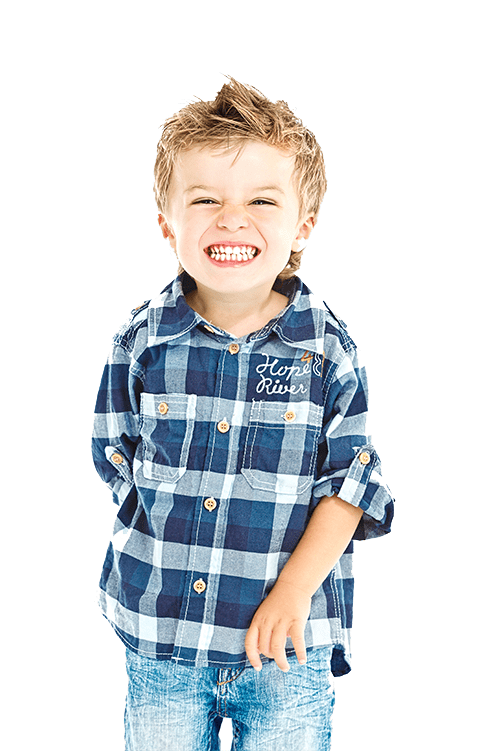 kid smiling showing his teeth
